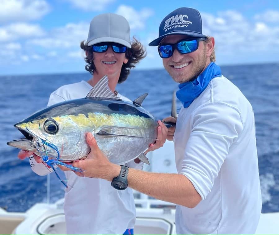 Teenager and adult posing with Tuna caught offshore off of Stuart, Florida.